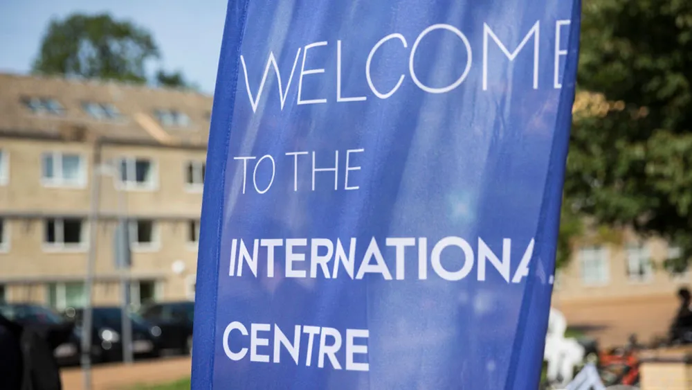 Blue flag with the text "Welcome to the international centre"