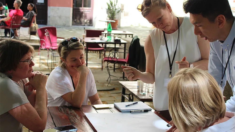 People around a table discussing something