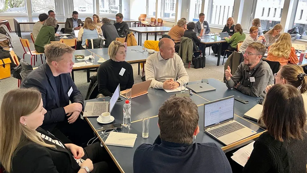 Group of people sitting around a table