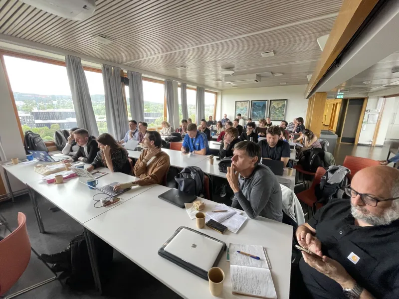 Students and professors in a class room at the University of Oslo.