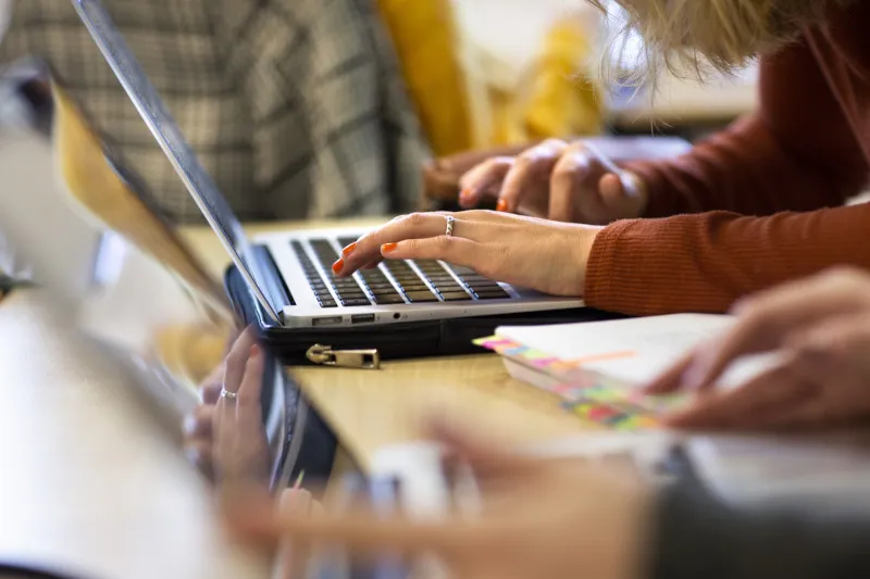 Student with laptop.