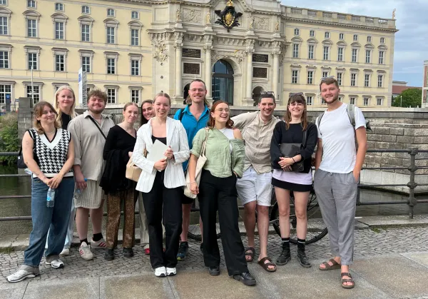 A group of people standing outside Berlin Palace.