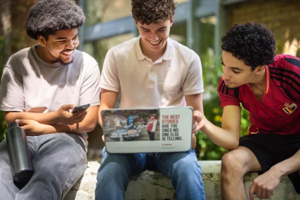 Students at UCLouvain Louvain-la-Neuve Campus, looking at a computer