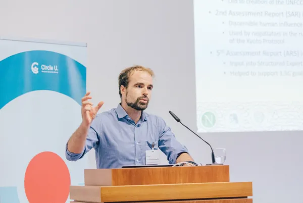 A man speaking at a lectern