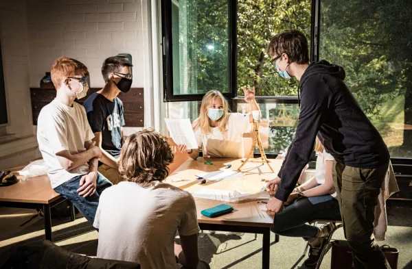 Student project: students sitting around a table