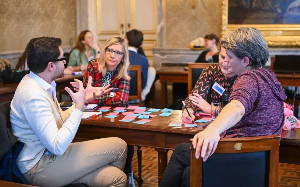 Four people around a table